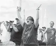  ?? JULIE FLETCHER/AP ?? Vanessa Fabrega cheers as she watches the launch of space shuttle Atlantis in 2011 in Cape Canaveral, Fla.