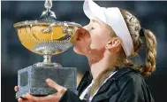  ?? Photo: EPA ?? Elena Rybakina kisses her Italian Open trophy.