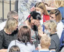  ?? REUTERS ?? People react near School Number 175 after a deadly shooting in Kazan, Russia on Tuesday.