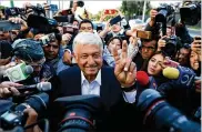  ?? GARY CORONADO / LOS ANGELES TIMES ?? Presidenti­al candidate Andrés Manuel López Obrador makes his way Sunday to a polling booth to cash his
ballot in the Coyoacán section of Mexico City. He won the presidency decisively.