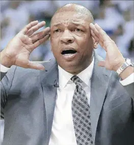  ?? Rick Bowmer Associated Press ?? CRITICS HAVE QUESTIONED Doc Rivers’ dual role, but now he says he is excited to concentrat­e on the coaching side with the Clippers’ revamped roster.