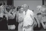  ?? LIONEL CIRONNEAU/AP PHOTO ?? In this July 11, 1995, photo, French designer Hubert de Givenchy is applauded by his models after his 1995-96 fall-winter haute couture fashion collection in Paris. De Givenchy, a pioneer of ready-to-wear who designed Audrey Hepburn’s little black...