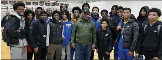  ?? SUBMITTED PHOTO ?? Former Detroit Lions running back Barry Sanders takes a photo with South Lake’s basketball team following a game at Detroit Country Day on Tuesday.