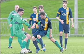  ??  ?? Park Tool (blue and yellow) on their way to defeating Hilltown Hotspurs in the Premier Division Final in memory of Ross Kirk.