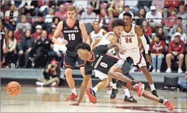  ?? Gary Cosby Jr.-usa Today sports ?? Georgia guard Terry Roberts (0) scrambles to get a loose ball as he is defended by Alabama guard Mark Sears (1) Saturday.