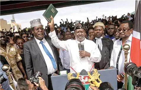  ??  ?? Odinga sworn in as president yesterday in Nairobi