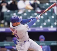  ?? David Zalubowski / Associated Press ?? The Mets’ Pete Alonso hits a solo home run off Rockies reliever Mychal Givens during the sixth inning of the first game of Saturday’s doublehead­er.