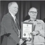  ?? KATHY JOHNSON ?? Dick Stewart accepts an Award of Excellence from Nova Scotia Fisheries and Aquacultur­e Minister Keith Colwell at the annual fisheries minister’s conference in Halifax on Feb. 22. Stewart was honoured for a “lifetime of service to Nova’s Scotia’s...