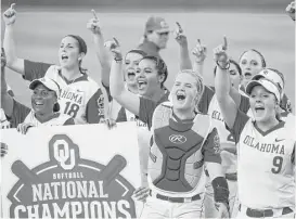  ?? Sue Ogrocki / Associated Press ?? Oklahoma players cheer in unison after defeating Auburn 2-1 on Wednesday night to win the Women’s College World Series.