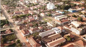  ??  ?? An aerial view of buildings around the Praca Che Guevara square (centre) with the adjacent France-Guinea Bissau cultural centre (centrerigh­t) in Bissau, capital city of Guinea-Bissau, the day before the country’s parliament election. — AFP photo