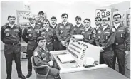  ?? FILE/AP ?? Allan Childers, second right, poses with others on a Titan II missile crew at Damascus, Ark.