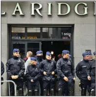  ?? (AP/Sylvain Plazy) ?? Police stand guard outside the front entrance of the event venue as the National Conservati­sm conference takes place Tuesday in Brussels.