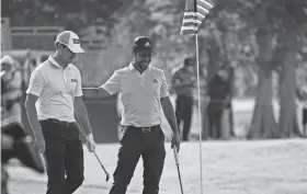  ?? ANDREW WEVERS/USA TODAY SPORTS ?? Xander Schauffele, right, and Patrick Cantlay react on the 17th green during the first round of the Zurich Classic of New Orleans Thursday in Avondale, La.