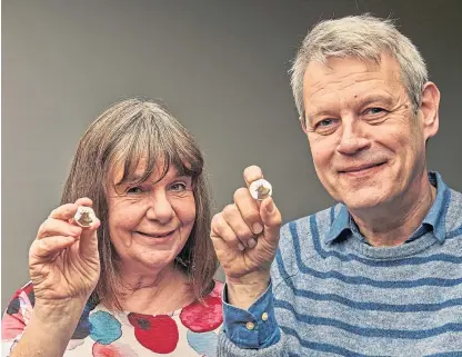  ?? Picture: PA. ?? Author and illustrato­r of The Gruffalo, Julia Donaldson and Axel Scheffler, with the coin.