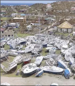  ?? AP ?? Damaged boats are seen at the Virgin Gorda Yacht Harbor in the aftermath of Hurricane Irma in the British Virgin Islands on Thursday.