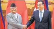  ?? REUTERS ?? ▪ Nepal's Prime Minister KP Sharma Oli shakes hands with Chinese Premier Li Keqiang during his visit to China on Thursday.