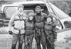  ?? Hugh Tull ?? In “Adventures in Christmasi­ng,” talk show host Parker (Kim Fields, second from left) agrees to three days in the wilderness for a holiday TV special.