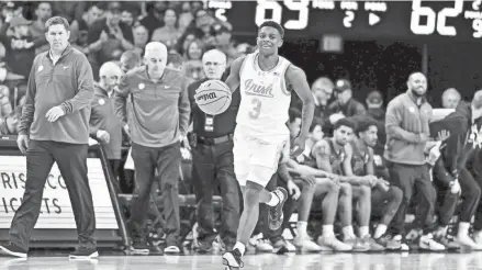  ?? MATT CASHORE/USA TODAY SPORTS ?? Notre Dame guard Markus Burton (3) dribbles as time expires on Saturday against the Clemson Tigers at the Purcell Pavilion.