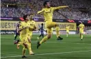  ?? ?? Manu Trigueros (right) celebrates with teammates Gerard Moreno and Alfonso Pedraza after opening the scoring for Villarreal. Photograph: Alex Caparros/UEFA/ Getty Images