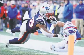  ?? Jim Rogash / Getty Images ?? The Patriots’ James White rushes for a 27-yard touchdown against the Bills on Dec. 23.