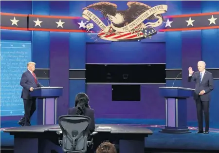  ??  ?? President Donald Trump and Democratic presidenti­al nominee Joe Biden take the stage at the final presidenti­al debate.