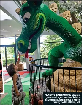  ??  ?? PLASTIC FANTASTIC: Claudia greets a dragon made of bricks at Legoland, and enjoys a mock Viking battle at Ribe, left