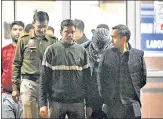  ?? ANI ?? Police escort Aaftab Poonawala (masked) out of Delhi’s Forensic Science Laboratory after he took a polygraph test on Thursday.