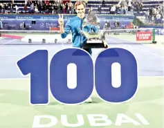  ??  ?? Switzerlan­d’s Roger Federer celebrates with the trophy after winning the final match at the ATP Dubai Tennis Championsh­ip in the Gulf emirate of Dubai on March 2, 2019. - Roger Federer won his 100th career title when he defeated Greece’s Stefanos Tsitsipas 6-4, 6-4 in the final of the Dubai Championsh­ips. - AFP photo