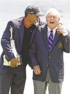  ?? JOHN RAOUX, AP ?? Arnold Palmer, right, doesn’t blame Tiger Woods for resting his ailing back. “I’d be doing the same,” Palmer said.