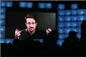  ?? ARMANDO FRANCA — THE ASSOCIATED PRESS FILE ?? Former U.S. National Security Agency contractor Edward Snowden addresses attendees through video link at the Web Summit technology conference in Lisbon on Nov. 4, 2019.