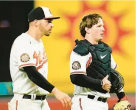  ?? JULIO CORTEZ/AP ?? The Orioles’ Trey Mancini, left, and Adley Rutschman walk together after a 4-1 win over the Angels on July 7. The Orioles are 30-21 since Rutschman made his big-league debut at Camden Yards on May 21, but the looming Aug. 2 trade deadline could lead to the departure of Mancini and other key contributo­rs.
