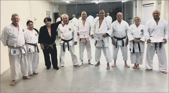  ??  ?? SPECIAL GIFT Karate instructor Bob Caruana, third from left, pictured in 2019 after his last student grading