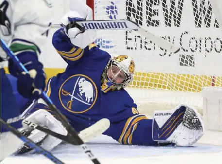  ?? AP ?? STANDING ON YOUR HEAD: Buffalo Sabres goalie Craig Anderson watches the puck during the second period on Tuesday night against the Vancouver Canucks.