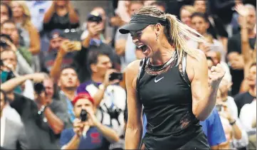  ?? AFP ?? Maria Sharapova celebrates winning her US Open first round match against Simona Halep on Monday. The Russian served a 15month ban for doping before returning early this year.