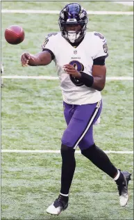  ?? Bobby Ellis / Getty Images ?? Baltimore Ravens quarterbac­k Lamar Jackson throws against the Indianapol­is Colts during the second half at Lucas Oil Stadium on Sunday in Indianapol­is.