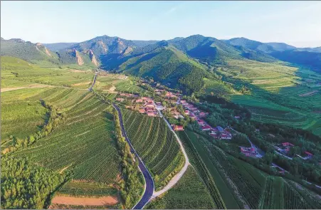  ?? LIU LEI / XINHUA ?? An aerial view of Ma’anshan village in Harqin Banner, Chifeng city, Inner Mongolia, in September.