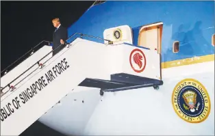  ?? AP PHOTO ?? President Donald Trump arrives at Paya Lebar Air Base for a summit with North Korean leader Kim Jong Un, Sunday.