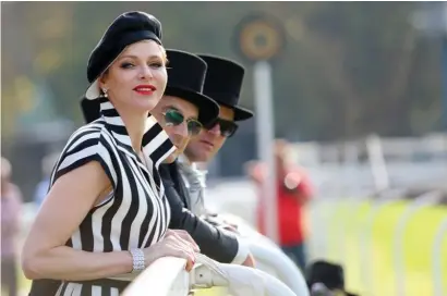  ?? Pictures: Royal Race Day, Palais Pricier de Monaco ?? SPORT OF KINGS: Her Serene Highness Princess Charlene of Monaco enjoys the action at Turffontei­n’s 2017 Royal Race Day. She has been a keen supporter of South African racing in recent years and now her husband, Prince Albert II, pictured below, has joined the action and become a sponsor of the Monaco Million Maiden, to be run in November.