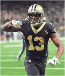  ??  ?? Saints wide receiver Michael Thomas celebrates his touchdown catch against the Eagles on Sunday. BILL FEIG/AP