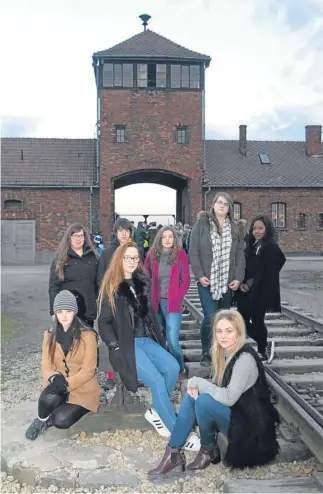  ??  ?? Some of the pupils at Auschwitz Back row: Fiona Muirhead (Carnoustie High), Samuel Hill and Rachael Elizabeth Reid (Forfar Academy), Agata Zydel and Panashe Dzambo (Viewforth High). Front row): Brooke Duncan (Carnoustie High), Kelsey Harvey and Abbie Marie Walker (Braeview Academy). Below, the sun sets over the former death camp.