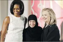  ?? CHARLES DHARAPAK/THE ASSOCIATED PRESS/FILES ?? Samar Badawi, shown in 2012 receiving the Internatio­nal Women of Courage Award from Michelle Obama and Hillary Clinton, has been arrested in Saudi Arabia. She is the sister of jailed dissident Raif Badawi.