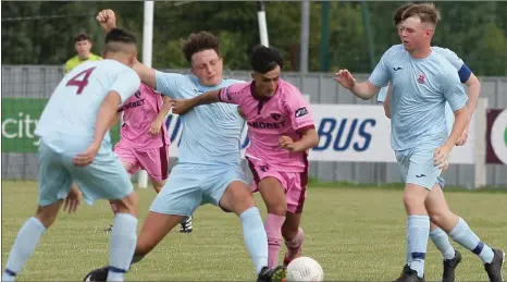  ??  ?? Adham Masood of Wexford F.C. coming under pressure from the Cobh Ramblers defence.