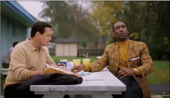  ??  ?? Tony Lip and don “doc” Shirley take a break from the road in “Green Book.”