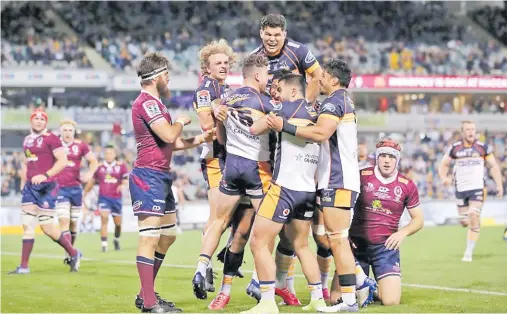  ?? Picture: RUGBY.COM.AU ?? Brumbies players celebrate after scoring a try in the Super Rugby AU competitio­n.