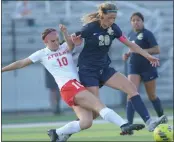  ?? KEN SWART — FOR MEDIANEWS GROUP ?? Stoney Creek’s Lilley Bosley (20) and Troy Athens’ Alaina Sharp (10) battle for the ball during the OAA Red match played on Thursday at Stoney Creek HS. Bosley scored the game-winning goal in the Cougars’ 2-0 win.