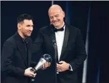  ?? MICHEL EULER / AP ?? Argentina’s Lionel Messi holds FIFA’s best men’s player award on Feb 27 after receiving it from FIFA President Gianni Infantino during a ceremony in Paris, France. After steering his team to World Cup glory in an epic final against Kylian Mbappe’s France last year in Qatar, Messi won the best player vote against Mbappe and Karim Benzema, and secured the FIFA prize for the seventh time in 14 years. The award is voted for by national team coaches and captains, journalist­s and fans.