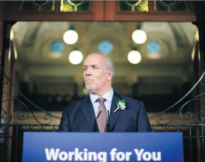  ?? CHAD HIPOLITO/THE CANADIAN PRESS ?? Premier John Horgan saved mention of the government’s intentions on dealing with increased bitumen shipments from Alberta through B.C. until the last few paragraphs of the throne speech, columnist Vaughn Palmer points out.