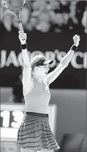  ?? Mark Dadswell European Pressphoto Agency ?? EUGENIE BOUCHARD reacts after defeating Ana Ivanovic in three sets. She will play Li Na next.