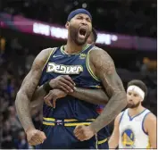  ?? DAVID ZALUBOWSKI — THE ASSOCIATED PRESS ?? NBA
The Nuggets’ Demarcus Cousins, front, celebrates after he scores vs. the Warriors as Jamychal Green hugs him.