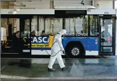  ?? XINHUA ?? A worker sanitizes a bus station in Cascais, a town near Lisbon in Portugal, on March 28. The country has recorded more than 11,200 confirmed cases of COVID-19 as of Monday.